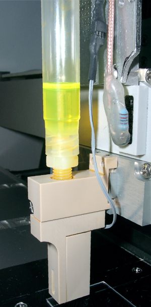 Piezoelectric (heatable) drop dispenser with cartridge reservoir