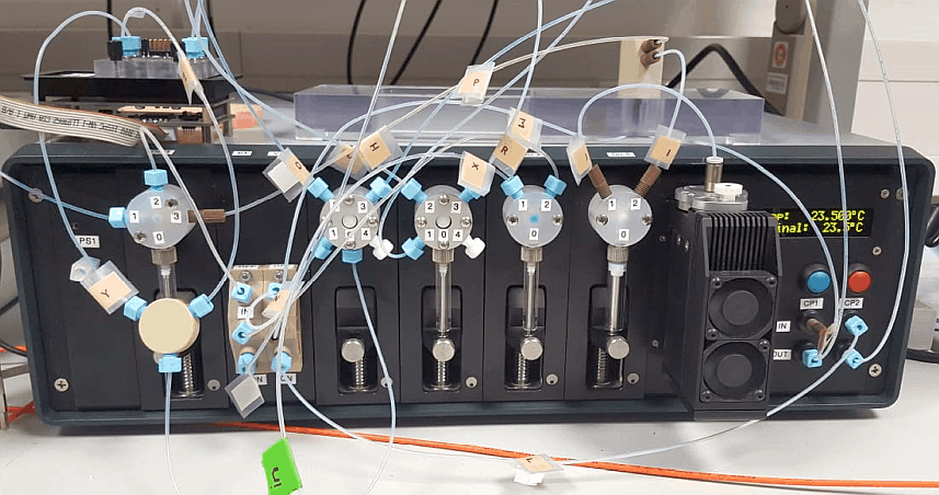 F-Box Fluid Processor for an SPR sensor, featuring various valves, four syringe pumps and a Peltier cooler with temperature controller.