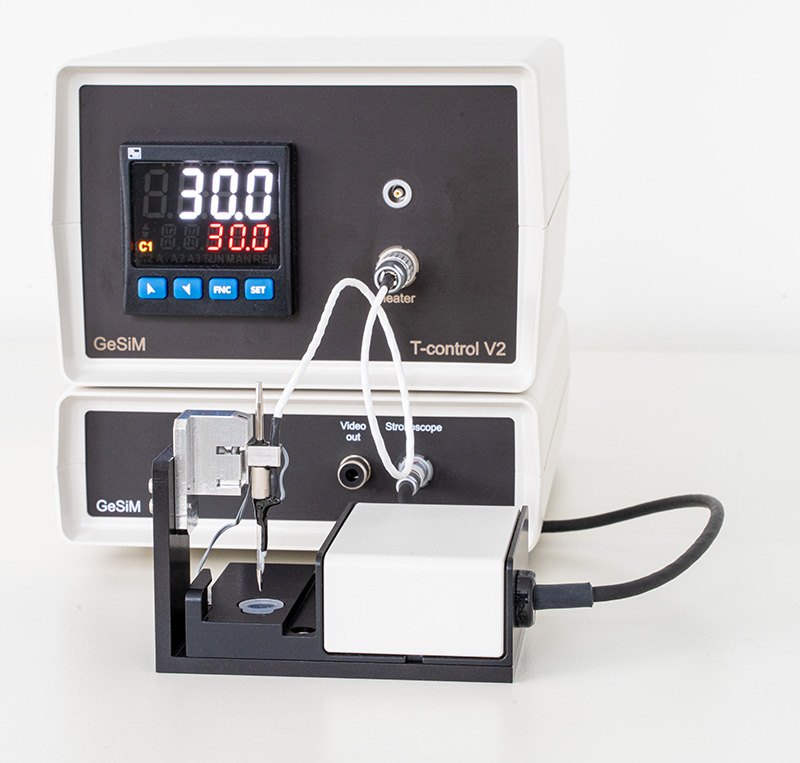 Heatable piezoelectric dispenser with temp controller